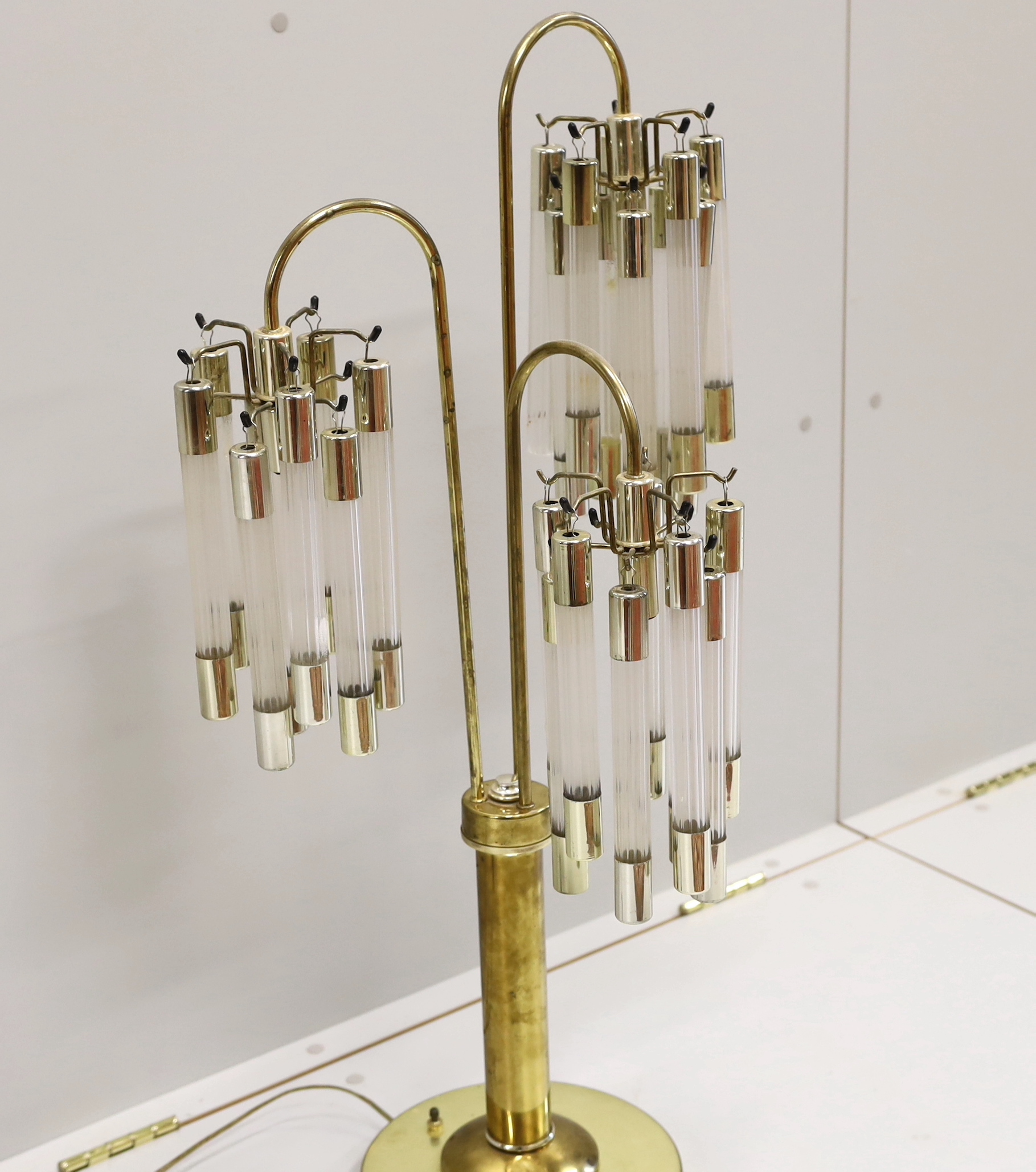 A contemporary brass and perspex three branch table lamp, height 91cm